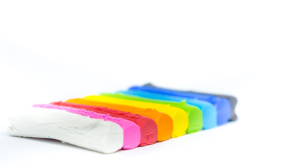 Closeup of colorful plasticine clay on white background