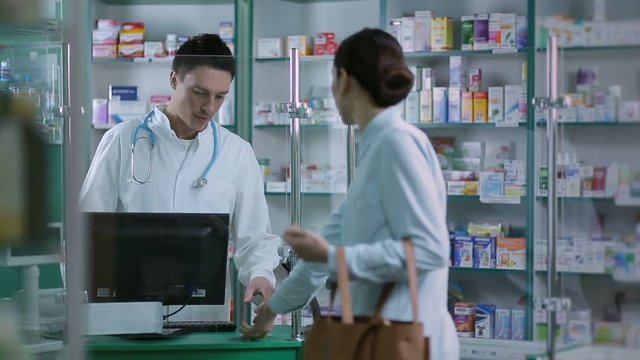 Girl giving prescription to pharmacist in pharmacy