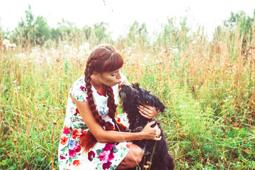 woman on nature with a dog