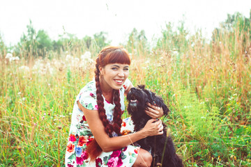 woman on nature with a dog