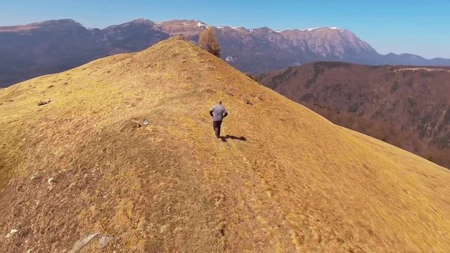 Runer On A Mountain Trail
