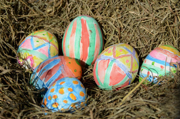 Fototapeta na wymiar Painted easter eggs in a nest.