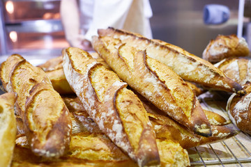 Fresh baguette bread with crust in bakery