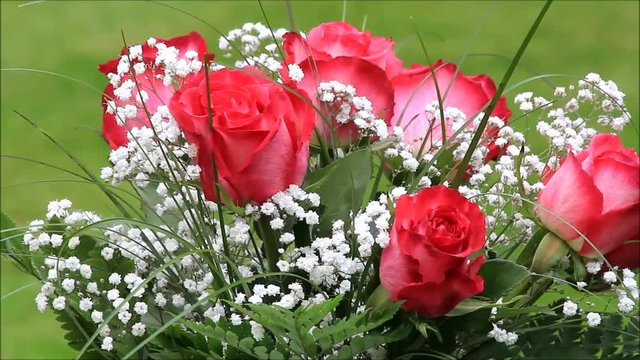 red roses bouquet with white gypsophila
