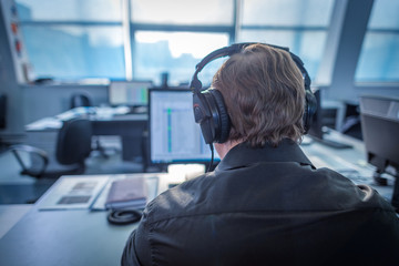 A journalist working on a computer in Newsroom