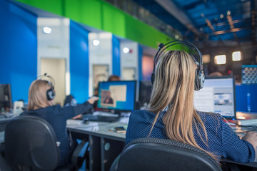 A journalist working on a computer in Newsroom