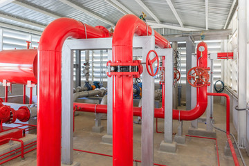 Industrial fire pump station for water sprinkler piping and fire alarm control system. Pipelines, water pump, valves, manometers.