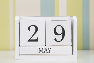 Cube shape calendar for MAY 29 on white table. 
