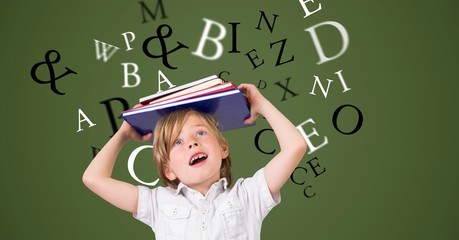 Boy carrying book on head with letters
