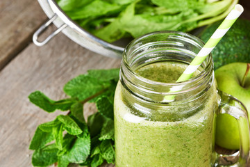 Healthy green smoothie in glass mug