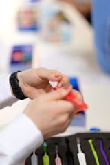 Demonstration of samples of toothbrushes at a dental exhibition