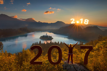 Girl with rising arms at 2017 and looking forward to 2018