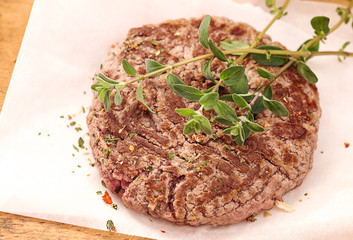 top view of hamburger with spies and marjoram