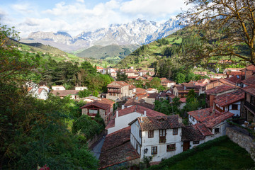 Fototapeta na wymiar The town of Potes at a sunny morning on a background of mountains, Cantabria, Spain.