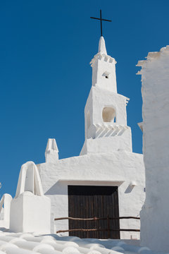 Bell tower in a fishing village, Menorca. Spain