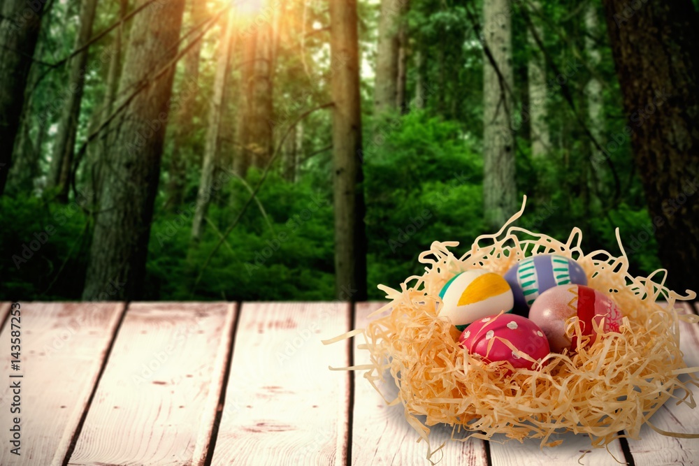 Poster composite image of patterned easter eggs in paper nest
