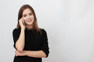 Young Businesswoman on the cell phone isolated on a white background