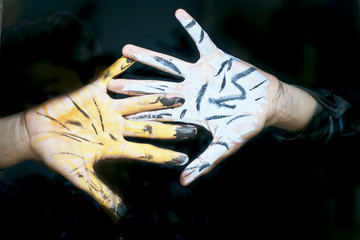 Human hand painted with poster color.