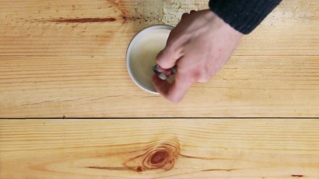 a pharmacist crushes pills to prepare a suspension