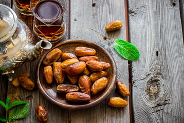 Tea with mint in arab style  on wooden table.