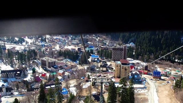 Accelerated shooting of the descent in the gondola cable car from the mountain on Dombay, Caucasus
