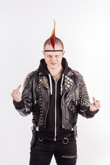 Portrait of punk rocker with Mohawk showing middle finger on a white background.