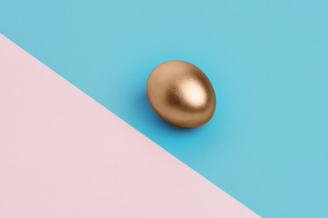 golden egg on the blue and pink background