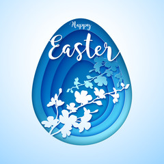Easter postcard with cut out vintage blue colored paper egg with silhouette of blooming tree.