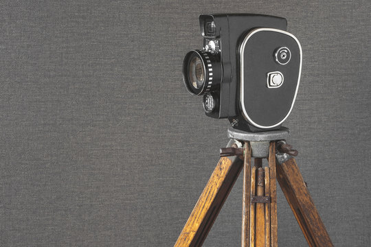 Old movie camera on a tripod