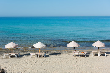 Beach umbrellas, Formentera, Spain