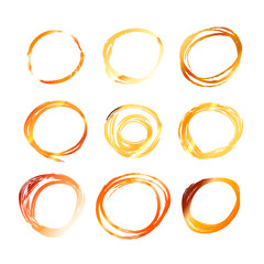 Nine golden hand drawn scribble circles isolated on white