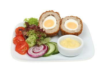 Scotch egg and salad on a plate