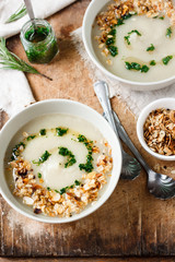 Celery cream soup with green oil and granola