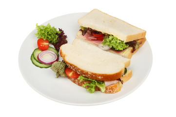White bread ham sandwich on a plate