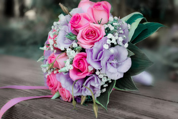 Wedding bouquet of flowers on a bench