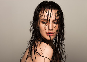 Beauty fashion model girl natural makeup wet hair
