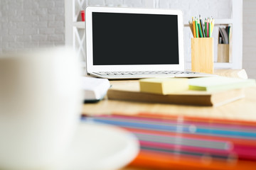 Coffee cup and notebook