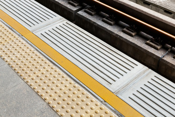 Blind floor tiles on train station platform