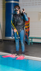 scuba diving course pool teenager girl with instructor  

