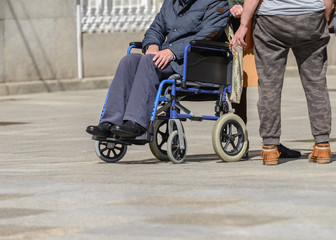 disabled person in a wheelchair on a city street