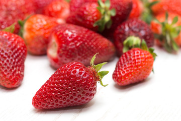 Fresh strawberries on a white background.