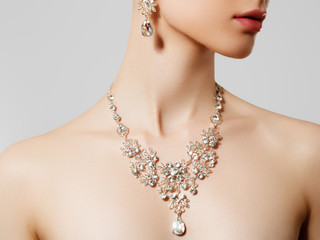 Elegant woman with jewelry. Beautiful woman with diamond necklace. Young beauty model with diamond...