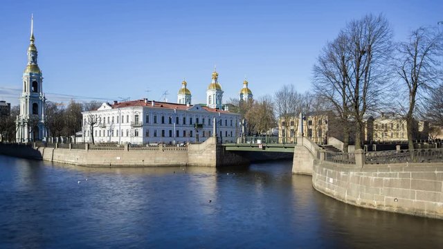 St. Nicholas Naval Cathedral and the Kryukov Canal Embankment in spring sunny day with blue sky, Saint-Petersburg, Russia.