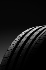 Car tire on black background
