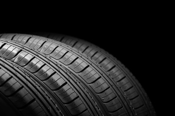 Car tires on black background