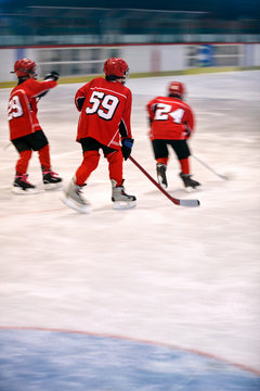 boys play ice hockey.