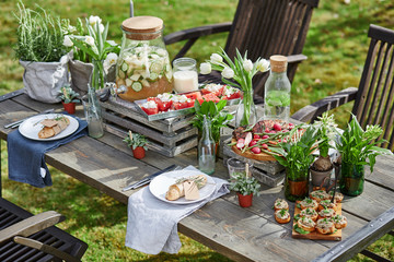 laid table with toasts,grilled meat, bran bread, watermelon and cottage cheese and flat belly diet drink
