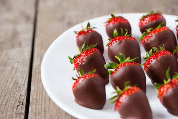 strawberries dipped in chocolate sauce.