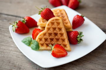 Belgian waffles with strawberries.