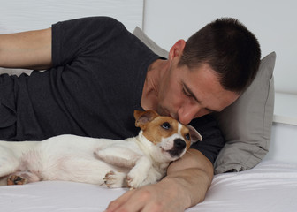 Man playing with a dog. Tenderness , concept